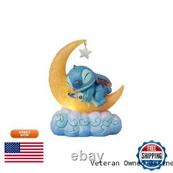 Collection Enesco Disney Traditions par Jim Shore tenant Scrump sur la lune éclairée