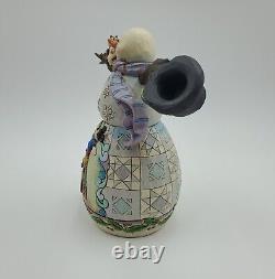 Jim Shore Disney Showcase Enesco Mischief and Merriment 4046019 Traditions translated in French would be 'Jim Shore Disney Showcase Enesco Esprit taquin et réjouissance 4046019 Traditions'.
